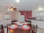 The dining area open to the fully equipped kitchen 